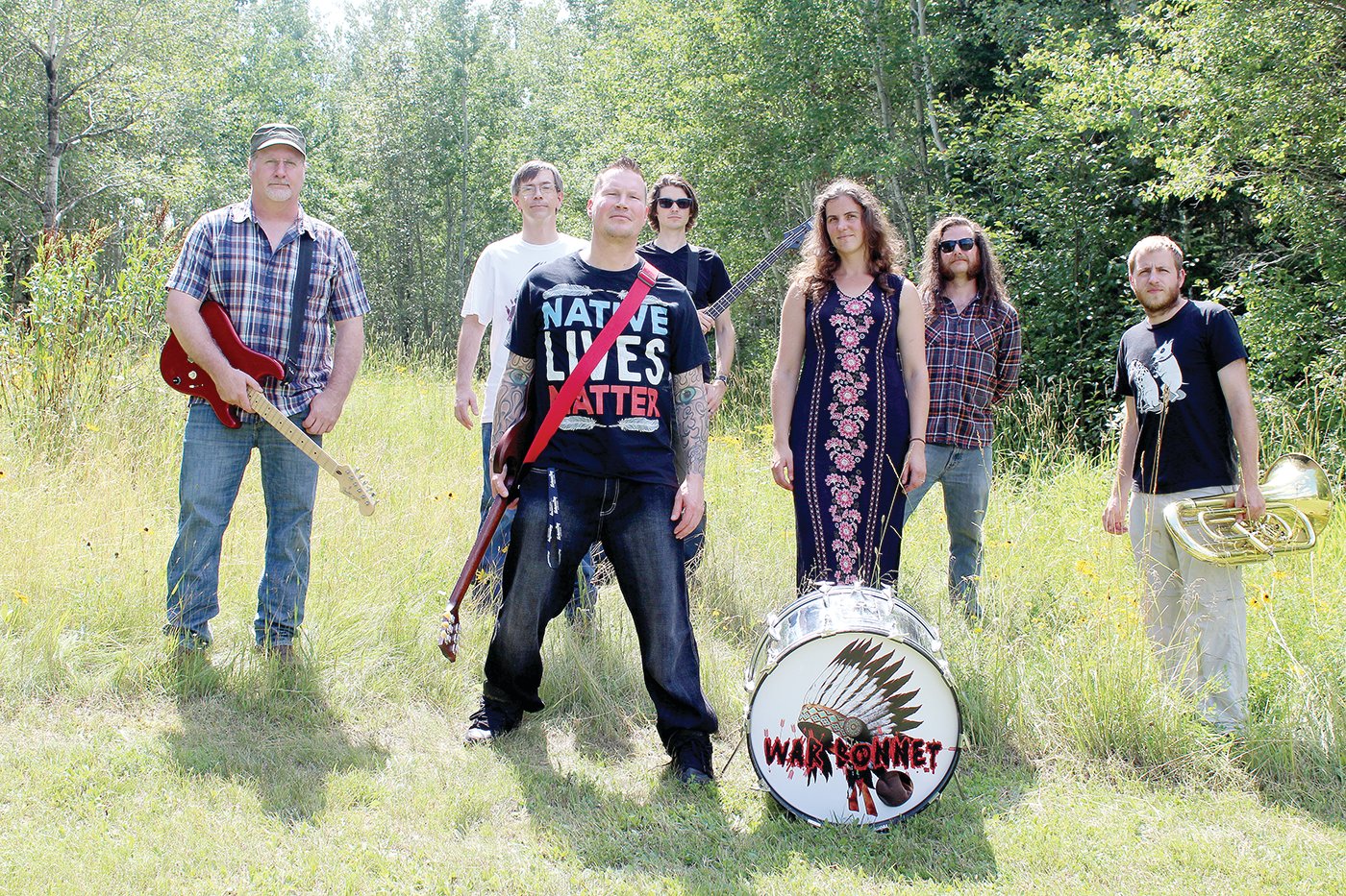 War Bonnet and their performance ensemble. Left to right are: Eric Krenz, Tony Parson, Chaz Wagner, Sean Zarn, Becky Frichek, Tom Frichek and Alex Mahne.