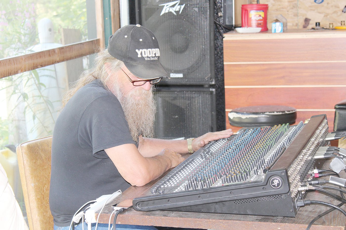 Sound technician John Young works the board at a War Bonnet rehearsal.