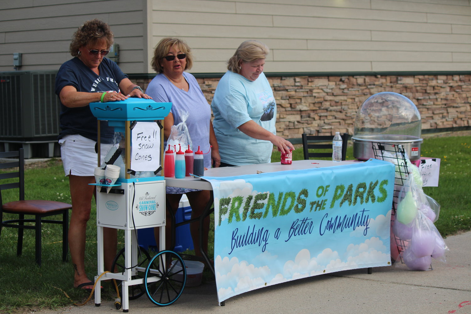 Diane Brunner, Sue Thomas and Carrolle Wood (left to right) offered guests free snow cones and cotton candy courtesy of Friends of the Parks.