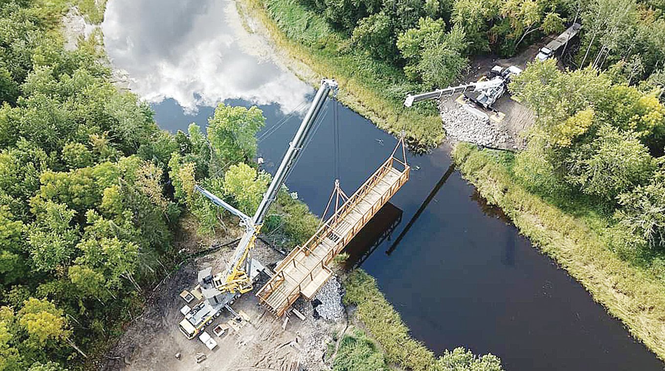 A 185-foot section of bridge was installed across the Vermilion River last weekend some 12 miles south of Crane Lake. The span completes a multi-use trail project in northwestern St. Louis County. A ribbon-cutting wil be held next Friday.