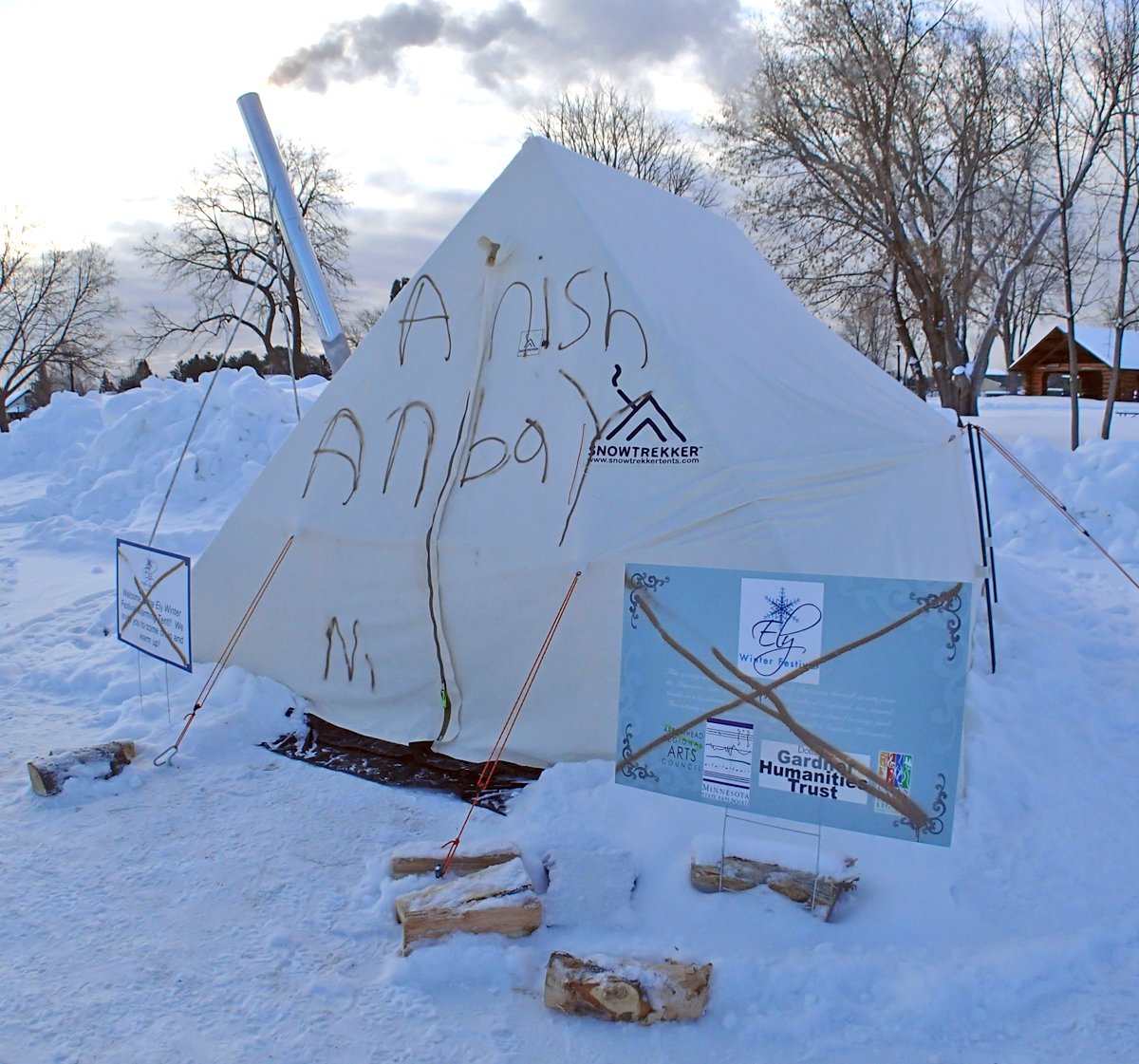 Spray paint damage mars a warming tent and sign in Whiteside Park.