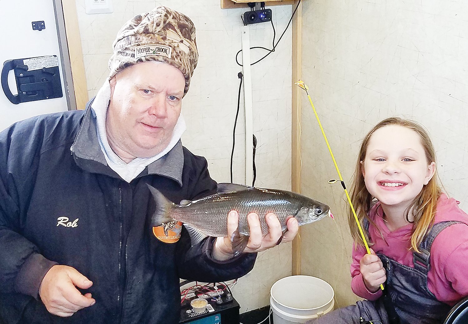 Guide Rob Bryers holds a nice whitefish caught by fifth-grade angler Elizabeth Udovich.