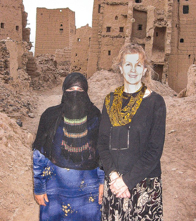 Sharon Beatty, at right, and a Yemeni woman pose for the camera at the ruins of the abandoned city of Marib.