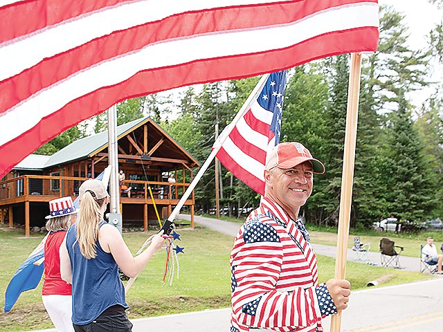 A big smile and lots of red, white, and blue at the Crane Lake parade.