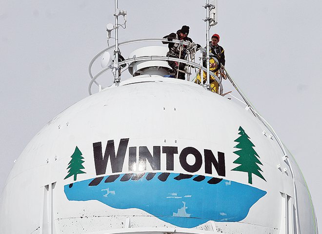 Technicians worked Monday afternoon to thaw out the frozen Winton water tower.