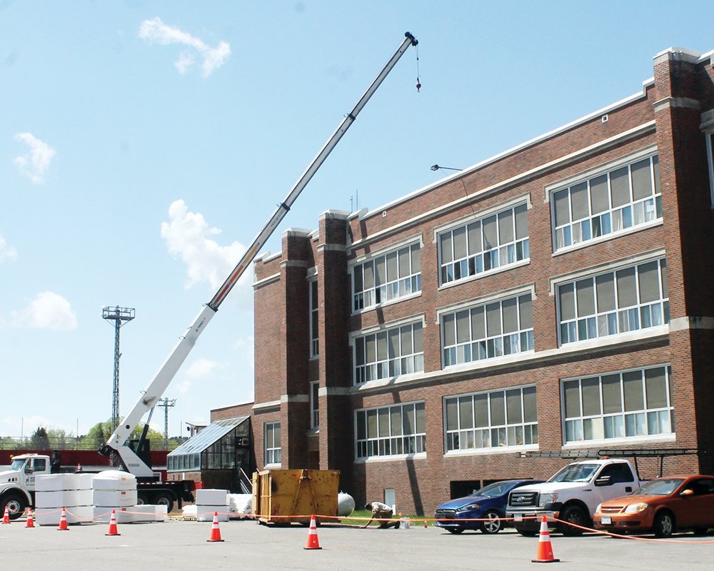 A new roof is being installed this week on the Memorial High School building.