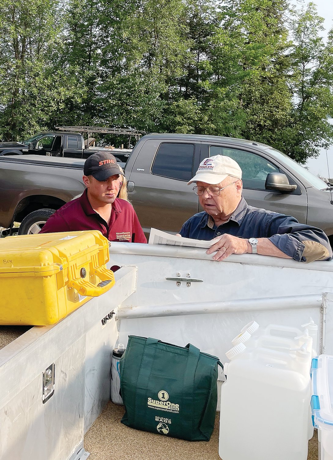 Lead researcher Josh Dumke (left) looks over the day’s plan with Jeff Lovgren from the Vermilion Lake Association.