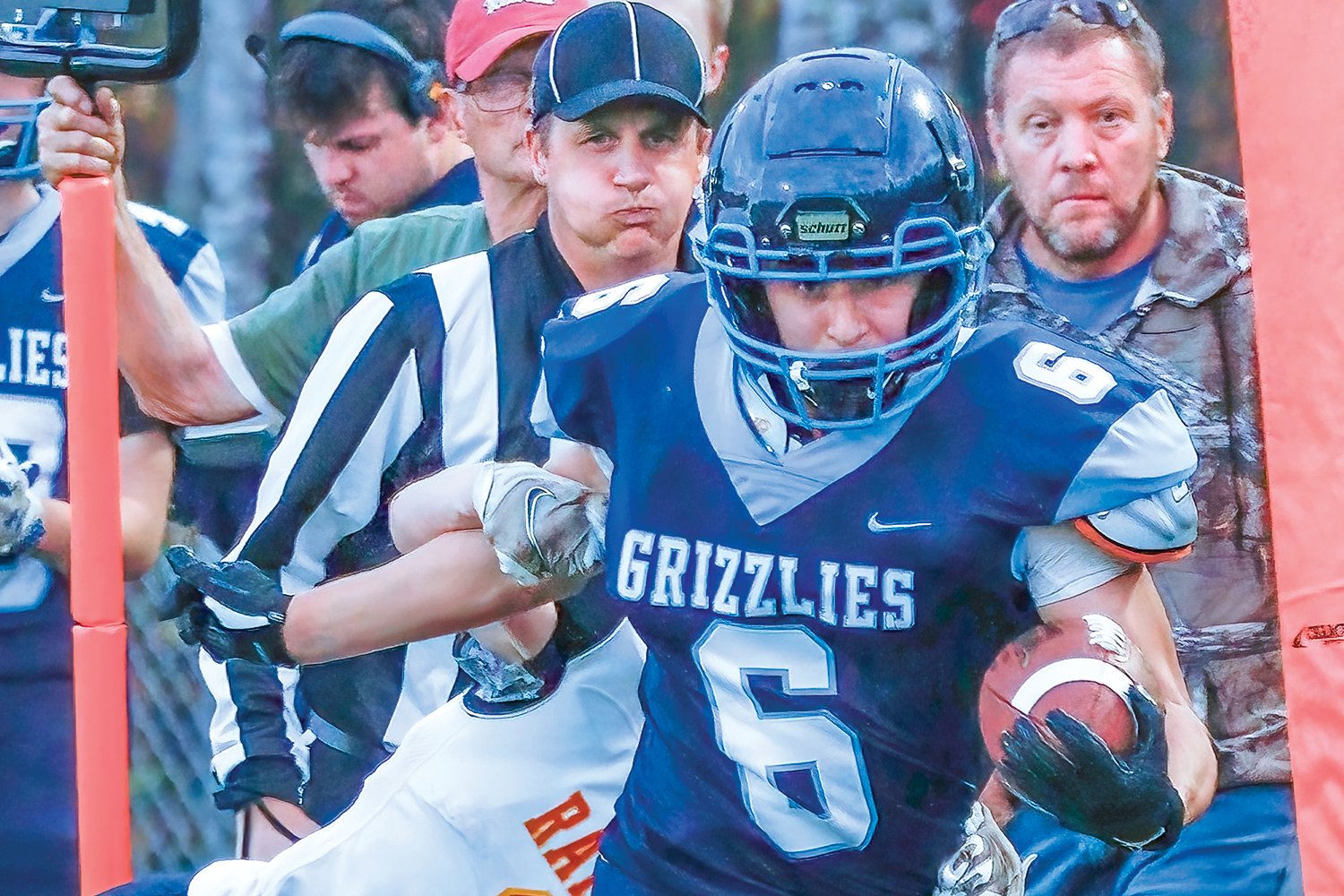 Jared Chiabotti sheds a Raiders tackler before streaking down the 
sideline for the Grizzlies’ first touchdown.