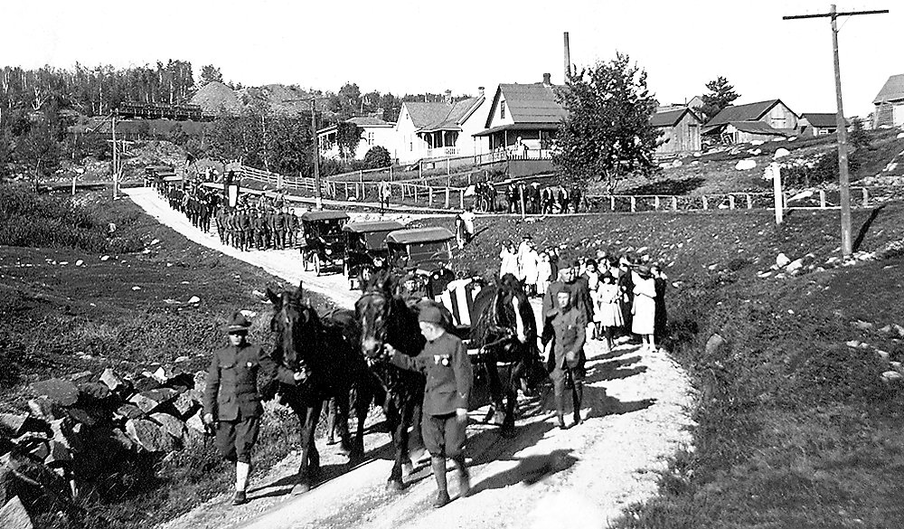 The 1921 funeral procession for Charles G. Nelson began in Soudan and traveled to Lakeview Cemetery, where he was buried with military honors.