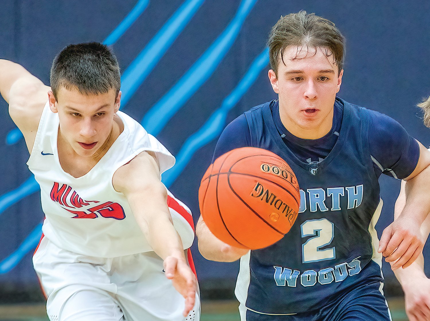 The Grizzlies’ Jared Chiabotti races ahead of a Moose Lake defender on a fast break.