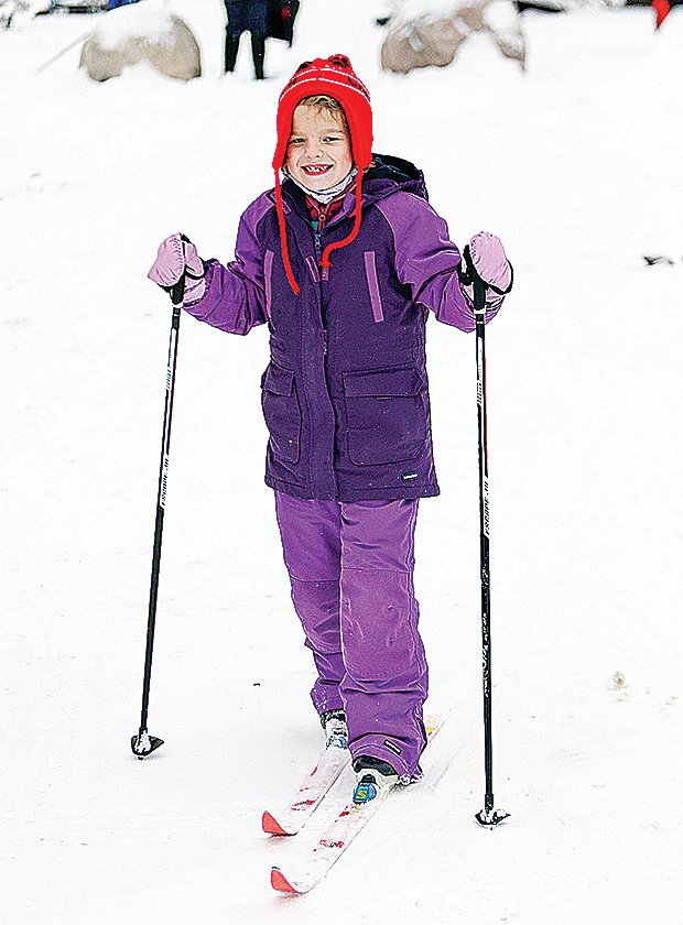 Macy Coombe, 7, was all smiles as she made her way down a trail.