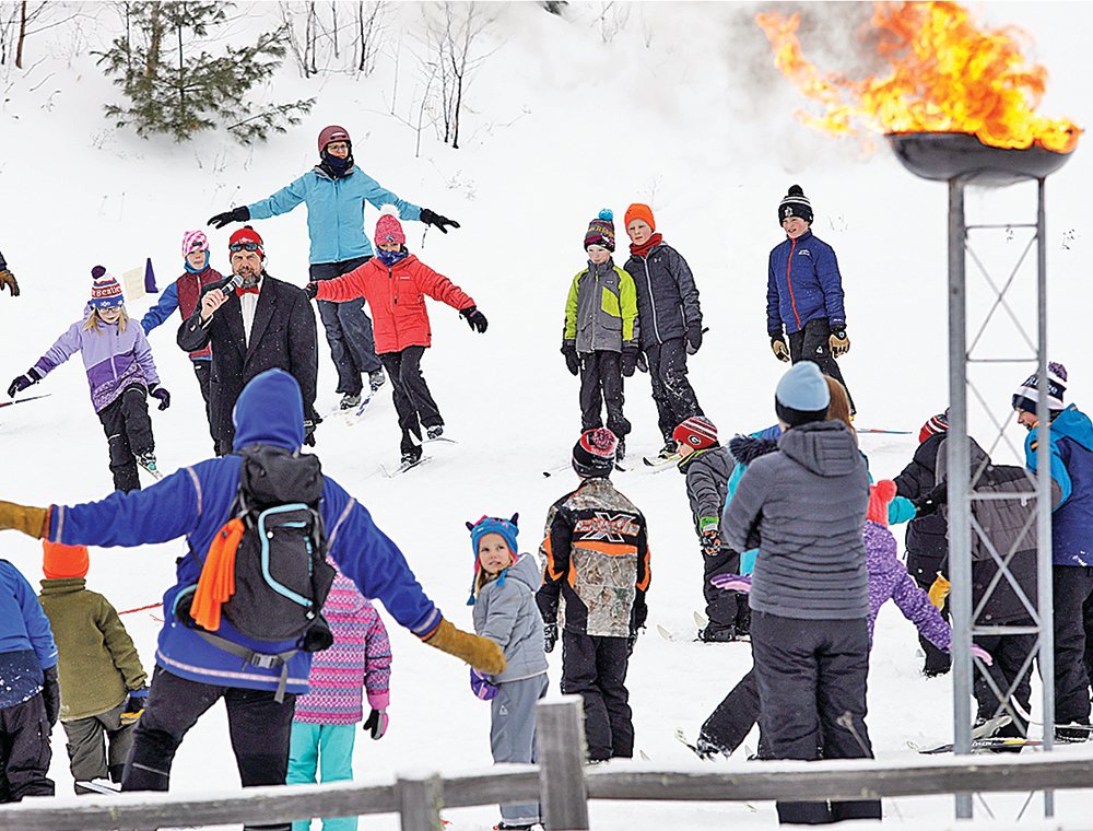 Enthusiastic kids hit the ski trail.