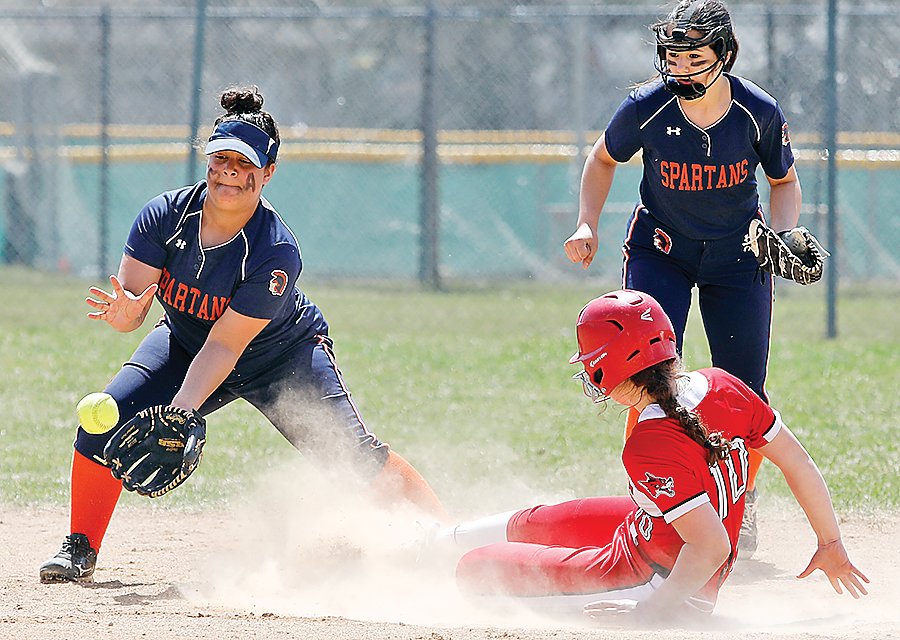 Ely’s Kate Coughlin slides safely into second base during Tuesday’s contest with the Spartans.