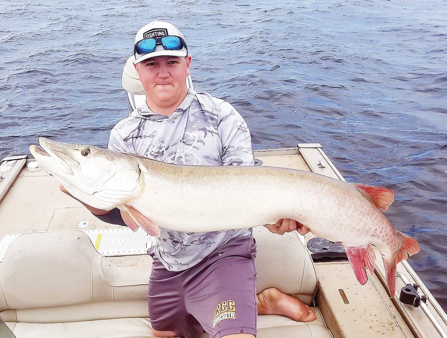 Brrett Vetterkind, of Somerset, Wis. hoists a 
51-1/2 inch musky he caught late last week on Lake Vermilion.