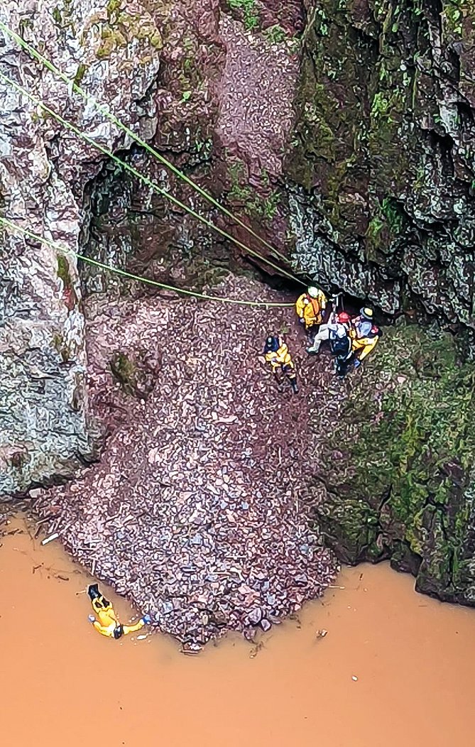 Members of the rescue squad at the 
bottom of the pit.