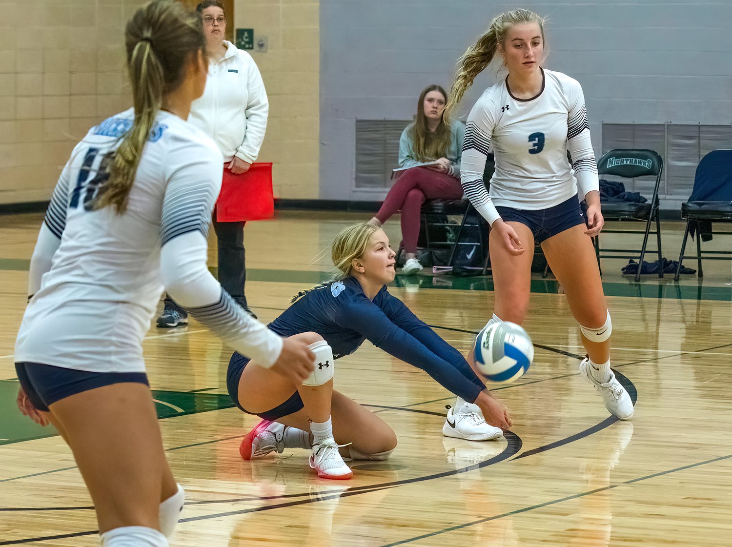 he Grizzlies’ Tori Olson goes low for a dig during last Thursday’s match-up with NER.
