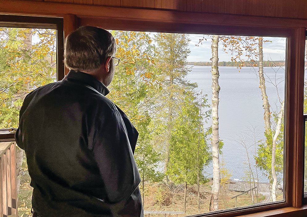 Hanson looks out over Birch Lake, where he grew up. He says he appreciates his ready access to clean water and wants to help ensure that area lakes remain healthy and free of the effects of pollution from sulfate.