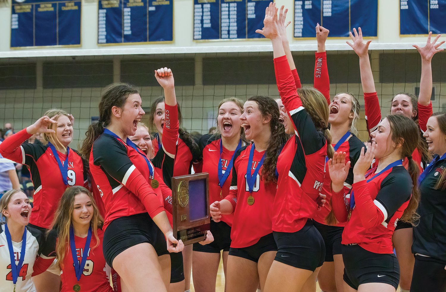 Members of the Ely volleyball team express their joy after winning the Section 7A title.