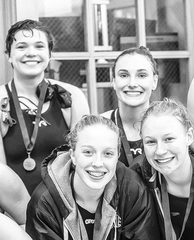 Fresh off their strong performance in the 200 
freestyle relay are team members Lily Tedrick, Anna Larson, Kelly Thompson and Morgan 
McClelland.