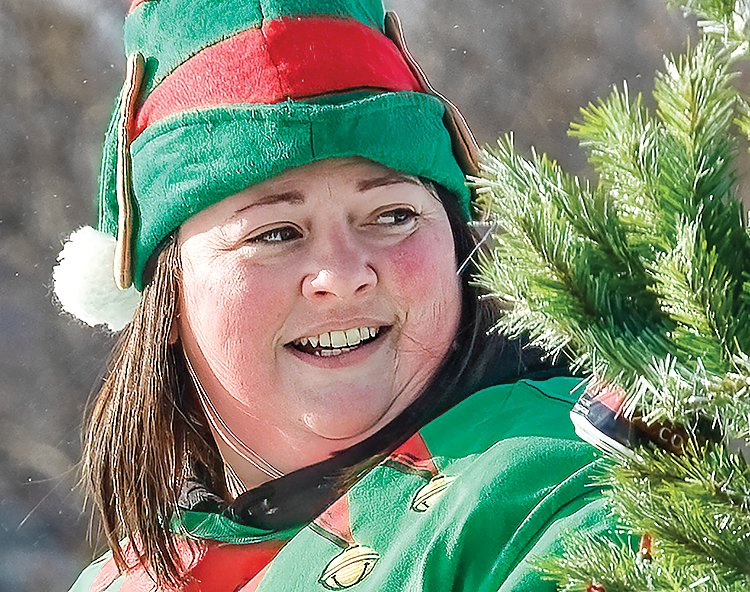 Cassie Laakkonen looks down the Snow City Christmas parade route in Orr last weekend.