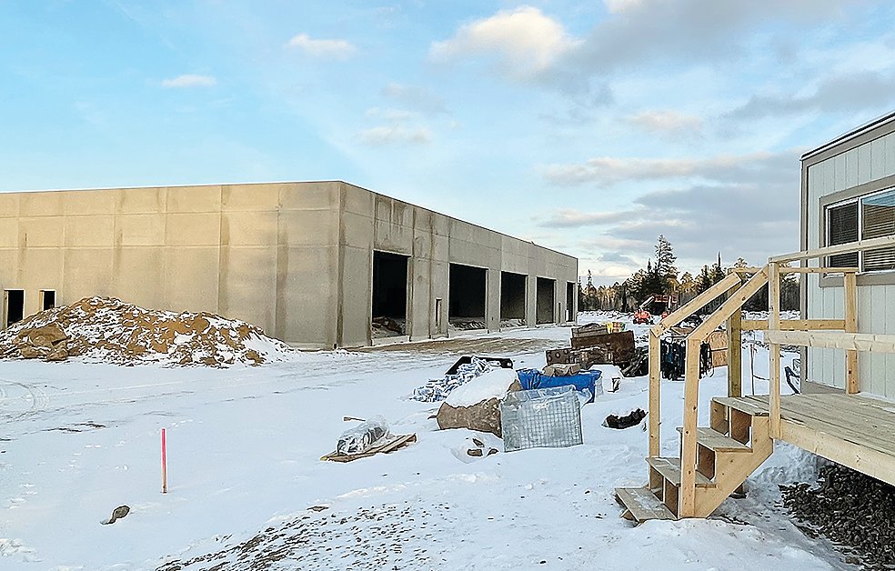 The walls and 
roof are up 
on the new county garage now under construction in Kugler Township.