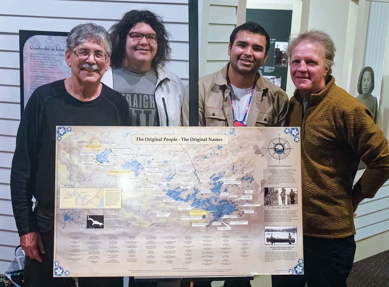 Posing with the new Ojibwe place names map at its Bois Forte Heritage Center unveiling are, from left, Bois Forte Band member and Ely Folk School board member Rick Anderson, center visitor services manager Kyle Littlewolf, center director Jaylen Strong, and EFS board member Paul Schurke.