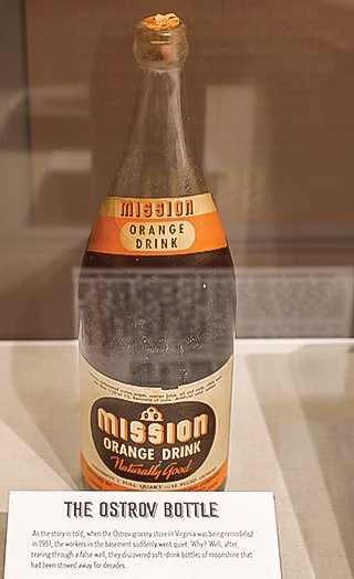 One of the only remaining bottles of “orange drink” found in a secret compartment in the old Ostrov Market in Virginia. The bottle actually contains 
moonshine.