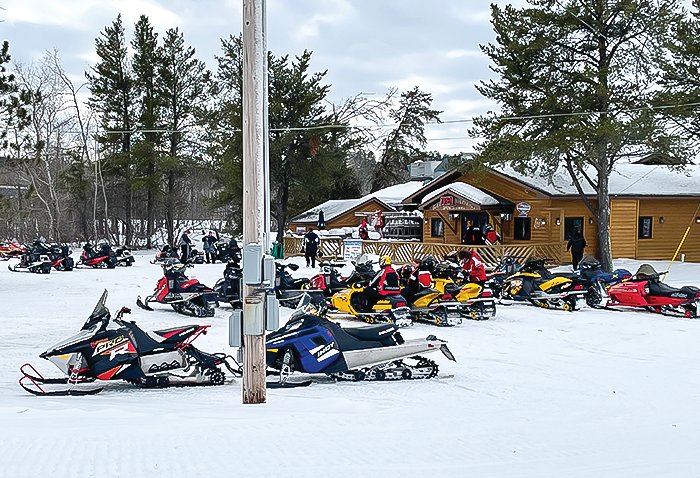 Dozens of sleds were parked outside Benchwarmer’s Bar and Grill in Tower over the weekend.