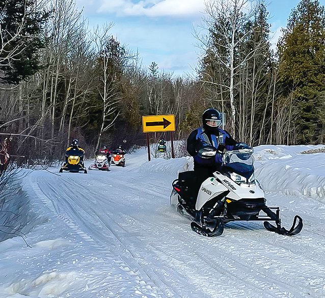 Snowmobilers have been out in force in recent weeks and that’s been a boon to the local economy. Abundant snow this winter has made for good riding.