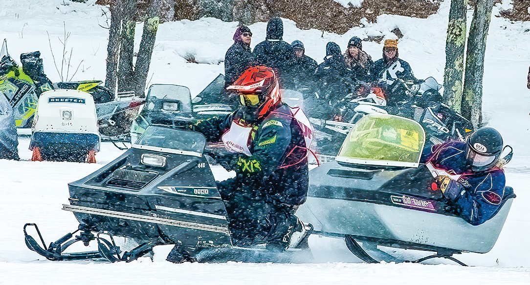 What appears at first to be a heated competition is actually a Cat Cutter being towed by a Lynx snowmobile.