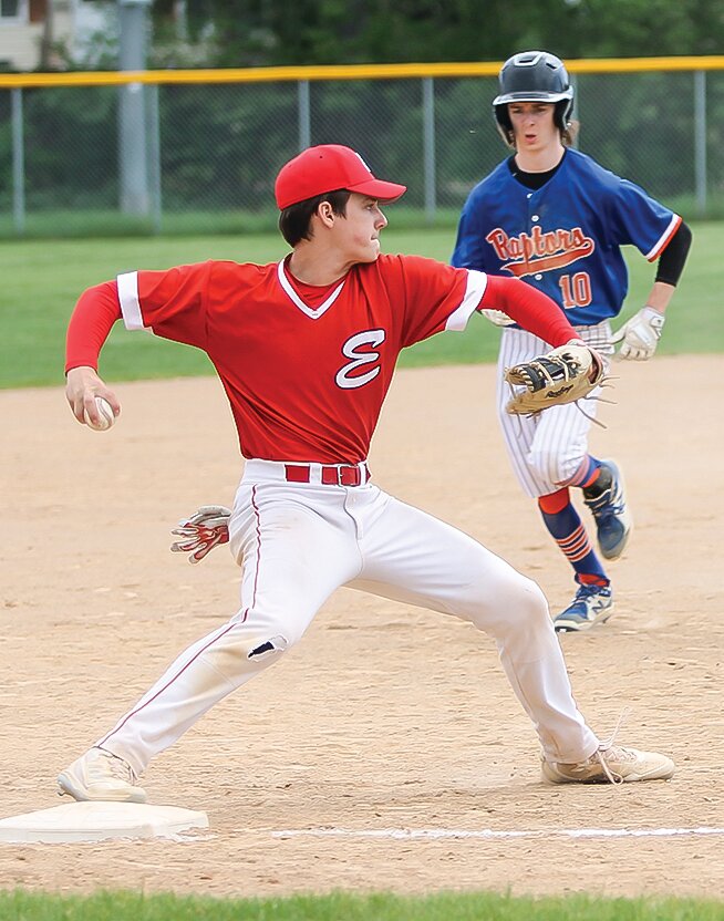 Ely’s third baseman Drew Marolt throws to first after notching a force out at third.