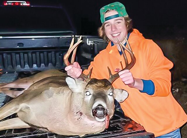 Fourteen-year-old Jack Anderson smiles big as he poses with the eight-point buck he shot Nov. 13 using his late grandpa’s rifle.