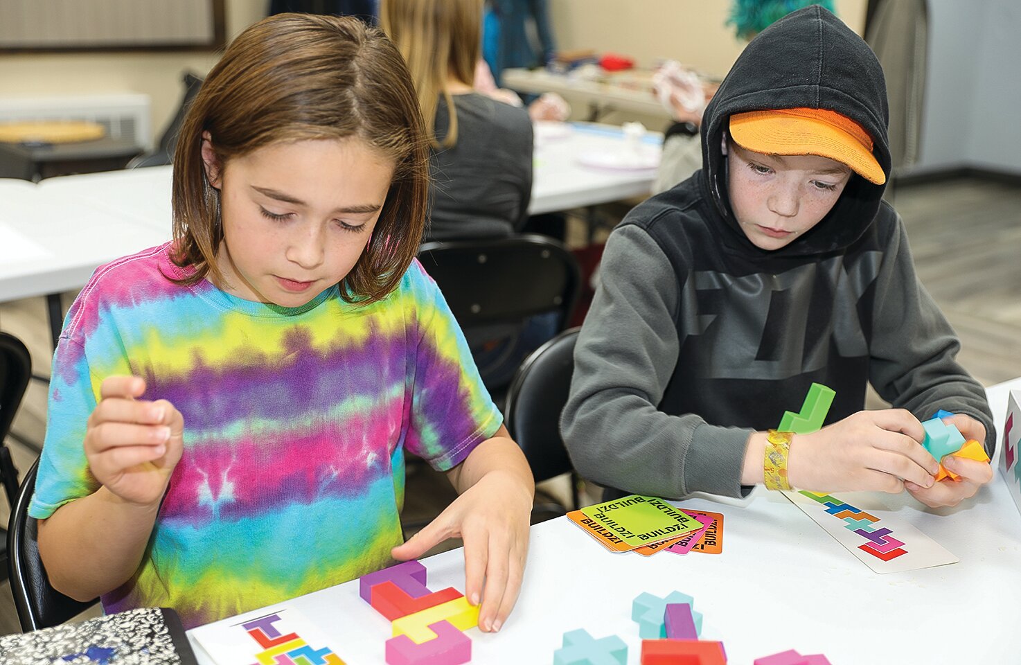 Mark Rettke and Gus Larson focus intently on a puzzle game during the first meeting of the new math club in Tower.