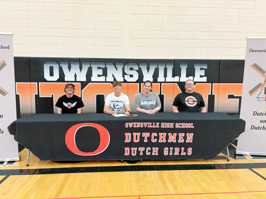 Ethan Harris (above, second from left) signs his letter of intent to continue his academic and athletic pursuits next school year for Westminster College in Fulton.