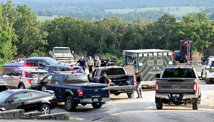 Law enforcement officers stage at the southern end of Voss Trailer Court in Osage County on Aug. 20 during the manhunt for Zachary Wheeler, who fled from Franklin County deputies.