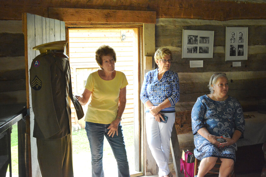 Sharon Wulff stands beside the World War II uniform of her late uncle Ellis Barnhart during a presentation about Barnhart’s military service at the Historical Society of Maries County’s Latham House last month.