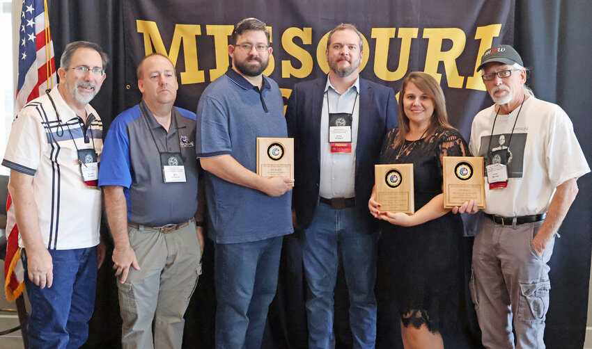 WARDEn Publishing Company staff (from left) Dennis Warden, Will Johnson, Jacob Warden, Roxie Murphy, and Dave Marner are pictured with Missouri Press Association President Amos Bridges during awards presentations at the 158th MPA Convention in Springfield, Mo. Not present for the awards ceremony were Colin Willard, James “Buck” Collier and Neal A. Johnson.