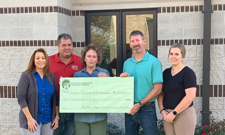 The Three Rivers’ Helping Hands Community Foundation awarded $10,000 to Always Tracking K-9 Services. The money will be used by owners Ben and Kim Sallin of Linn to purchase and train a dog for use with the Osage County Sheriff’s Office. Shown from left are Foundation Coordinator Vicki Lange, Foundation Trustee Wes Bailey, Foundation Chairman Sarah Stratman, Ben Sallin, and Kim Sallin.