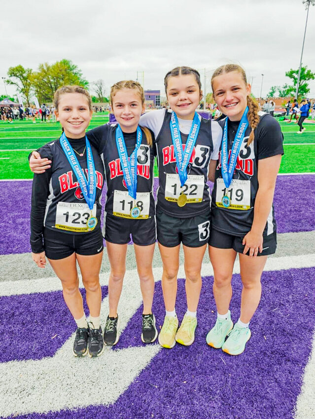 Bland girls 4x800m relay team members celebrate their state championship Saturday in Bolivar with a group photo.