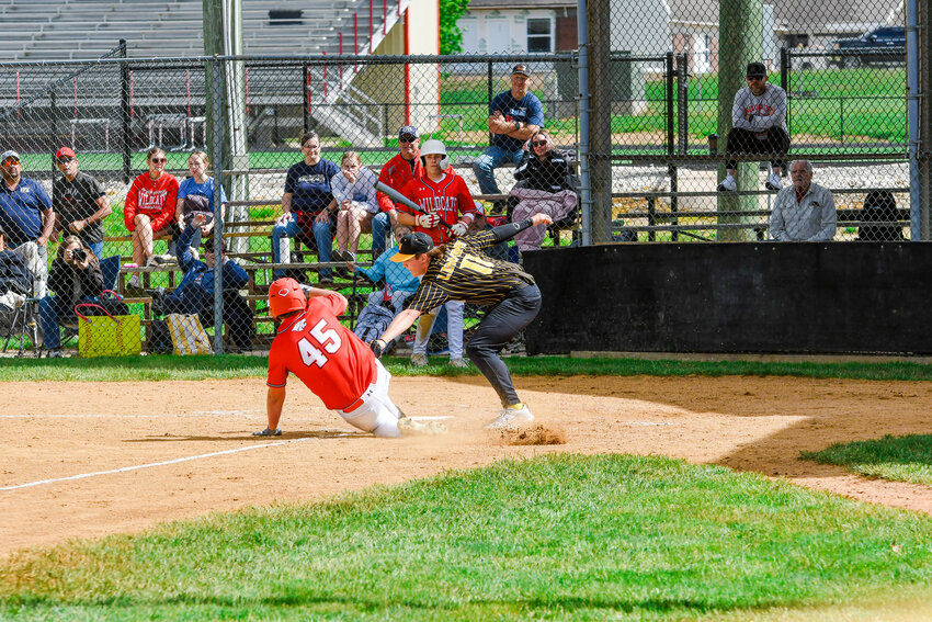 Waylon Lenning (above, center) tags out Linn&rsquo;s Peyton Peters trying to score during Vienna&rsquo;s 2-1 victory in rescheduled Monday baseball at Linn High School. Dylan Long (left, center) camps out under a fly ball for the Eagles in the bottom of the second inning. Vienna will end their regular season Monday hosting Belle&rsquo;s Tigers for senior night at Vienna City Park with a 5 p.m., first pitch for varsity action.