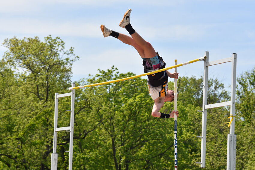 Cooper Auten (above) contorts his body over the bar in the boys pole vault during Saturday&rsquo;s MSHSAA Class 1, District 2 Track Meet at New Haven High School.