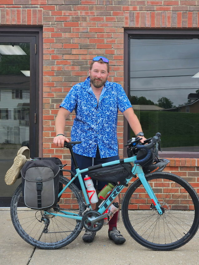 Dan Edwards, a visitor to Hermann from Omaha, Neb., is pictured after a stop at the local laundry, Das Wash Haus.