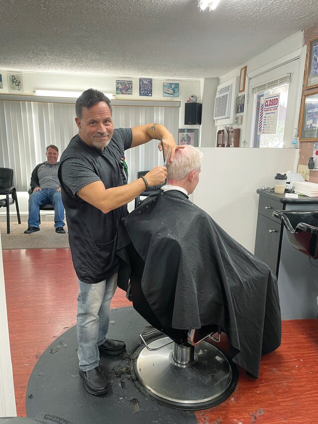 Meet Dave Picozzi, the owner of David’s Greenwood Barber Shop, seen here cutting the hair of one of his longtime customers who, like so many others, has been coming here for years and years! Come to this familiar landmark on Post Road for your springtime cut.
