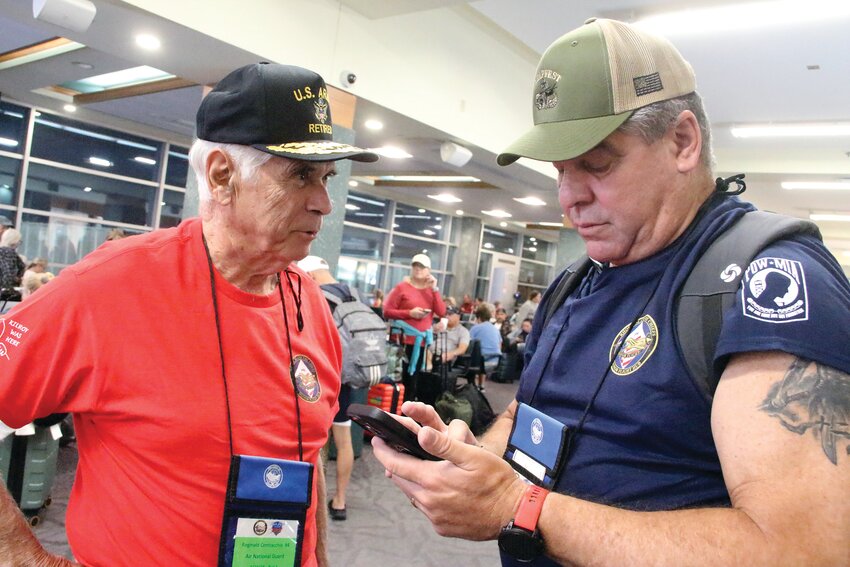 WHO’S IN CHARGE? Retired General Reginald Centracchio, former commander of the Rhode Island National Guard and his “guardian” for the Honor Flight, Ernest Almonte, before boarding Sunday’s flight to DC.