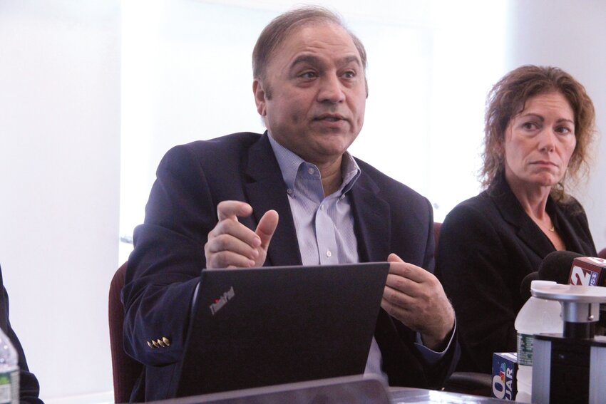 DEFENDING HIS MANAGEMENT: Iftikhar Ahmad, Rhode Island Airport Corporation President and CEO, outlines plans to identify those who wrote anonymous letters calling for his removal. Beside him is Nicole Williams, RIAC senior vice president of finance and administration. (Warwick Beacon photo)