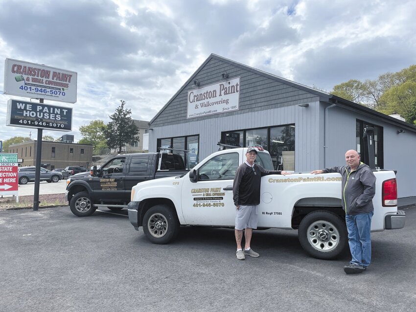 This familiar sight on Atwood Avenue, as well as these signature trucks, all remind home and business owners about Cranston Paint & Wallcovering – owned by Mike Sturdahl (left) and Bill McGuirk (right).  Call them for your exterior & interior paint jobs!