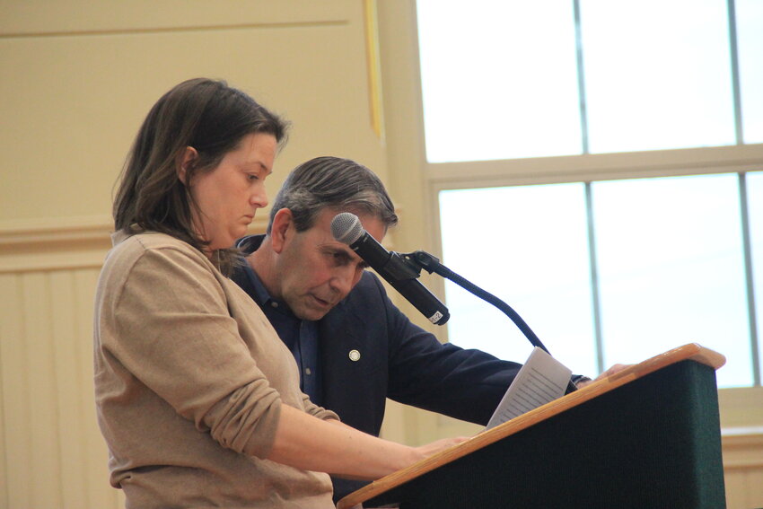 City Treasurer and Finance Director Lynne Prodger and Mayor Frank Picozzi review the wording of a resolution calling for a $50-million bond issue to complete construction of two high schools in response to a question from the council Monday night.   Beacon Media photo by John Howell