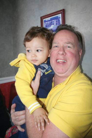 Mark Gilmore holds his grandson, 20-month-old Jaxson Langley.