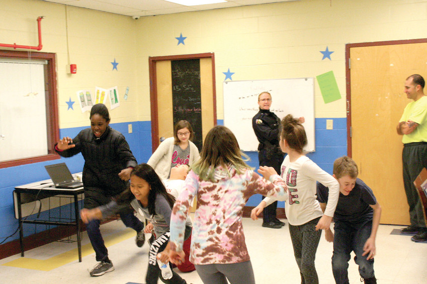 STRANGER DANGER: The students in the &ldquo;radKIDS&rdquo; program flee as Officer Jill Marshall pretends to be a &ldquo;bad stranger&rdquo; walking by.