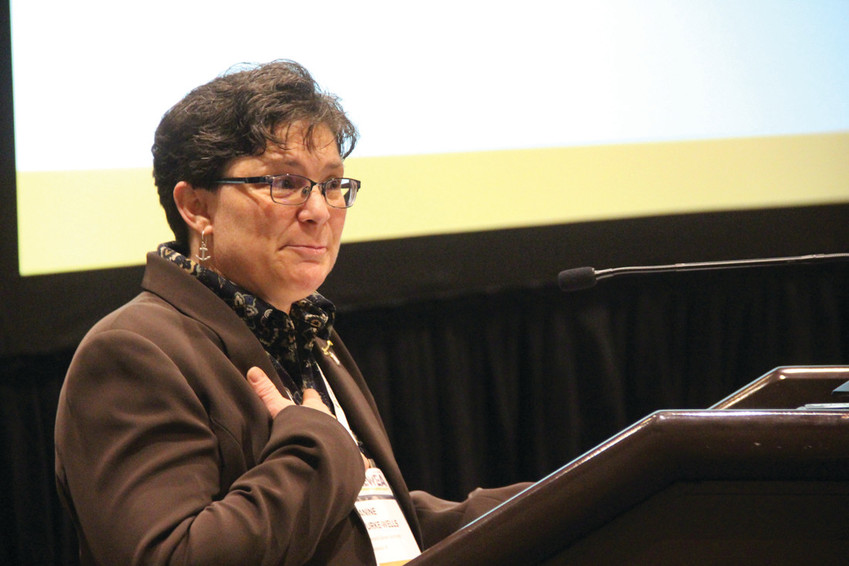 NEW LEADER: Janine Burke-Wells, executive director of the Warwick Sewer Authority, addresses the annual New England Water Environment Association awards ceremony last Wednesday in Boston. She is the new president of the organization.